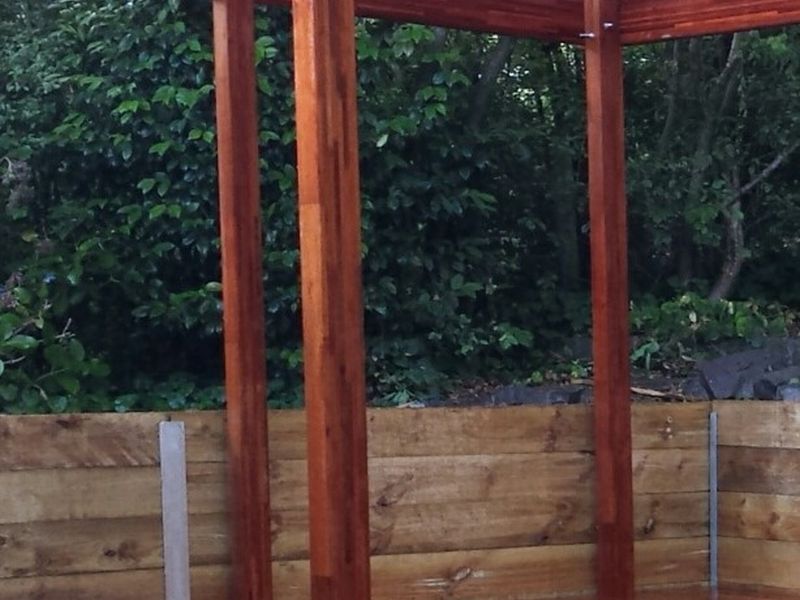 Merbau timber posts set beside a timber retaining wall