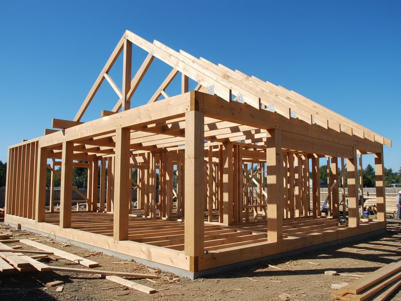 Pine structural timber house frame under construction